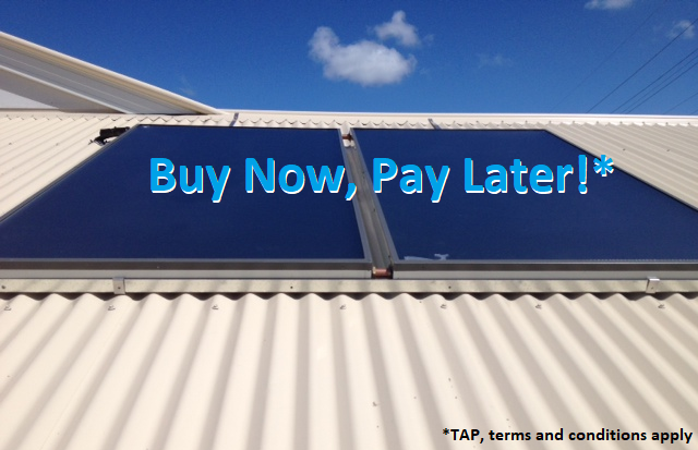 Solar hot water panels mounted on a corrugated roof in Gympie
